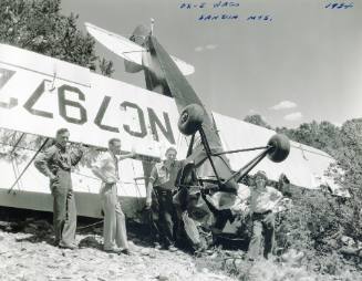 Men Near a Crashed Bi-plane
