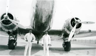 Two Men with a DC-3 Airplane