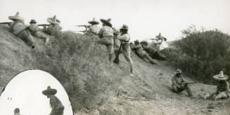 Revolutionary soldiers firing over the top of a ridge at the Battle of Rellano