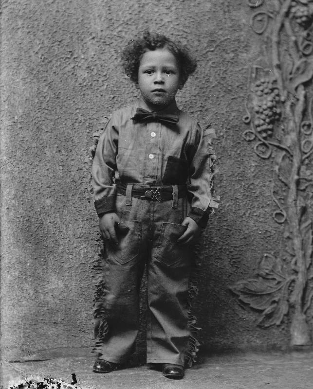 Boy in Fringed Shirt and Chaps