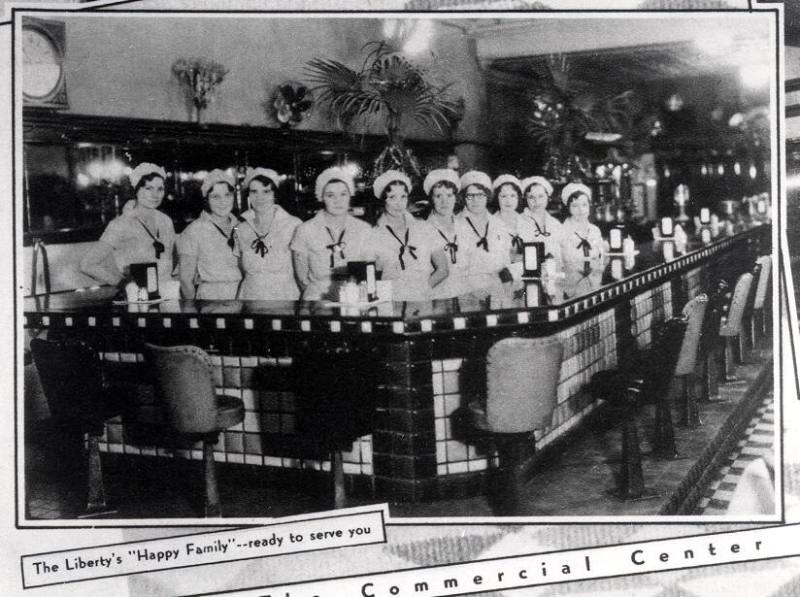 Interior of Liberty Cafe with waitresses lined up behind the bar