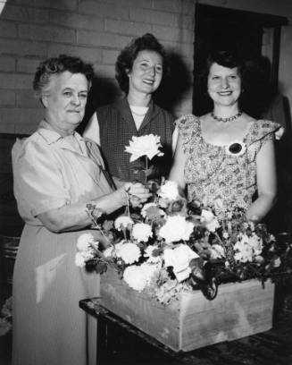 Chairwomen of local garden clubs at the State Fair's Flower Show