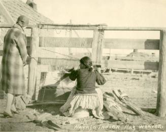 Navajo woman weaving