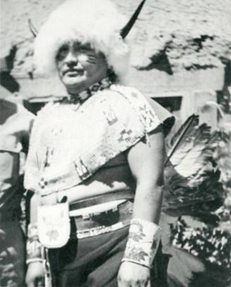 Native American man wearing buffalo dance attire