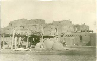 Taos Pueblo with hornos and wagons