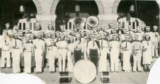 Las Vegas High School Marching Band stands in front of a large brick building