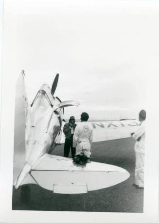 Jacqueline Cochran stands beside her airplane at Albuquerque Airport