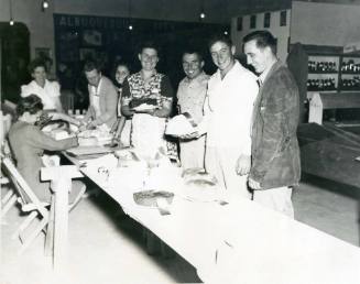 Unidentified judges look at prize-winning cakes