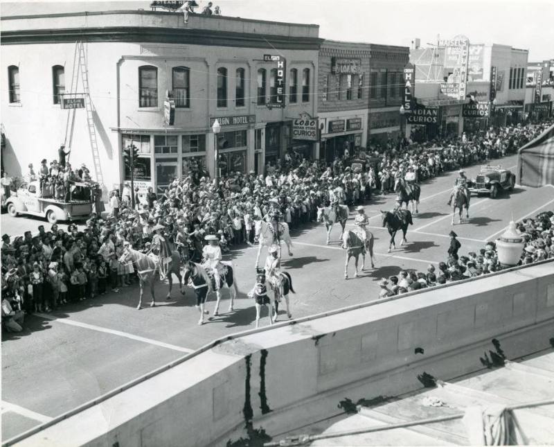 A rodeo group participates in the State Fair Parade
