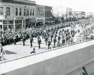 A marching band marches in the State Fair Parade