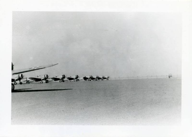 A line of eight Curtiss P-36 Pursuit Ships at the Albuquerque Airport