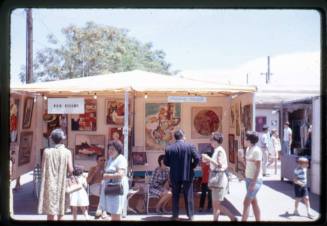 Two artist booths at an arts & crafts fair in Old Town