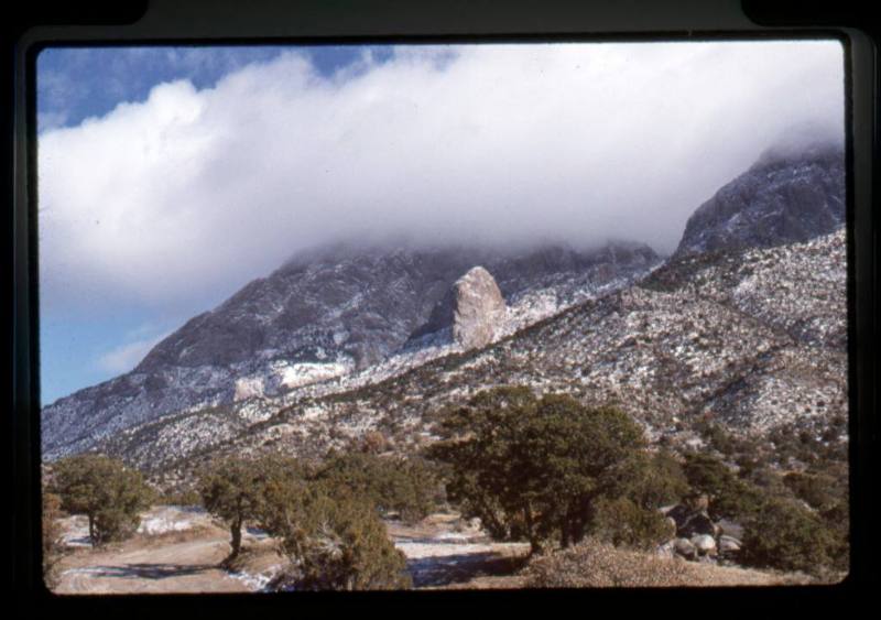 Foothills of the Sandia Mountains with snow and clouds