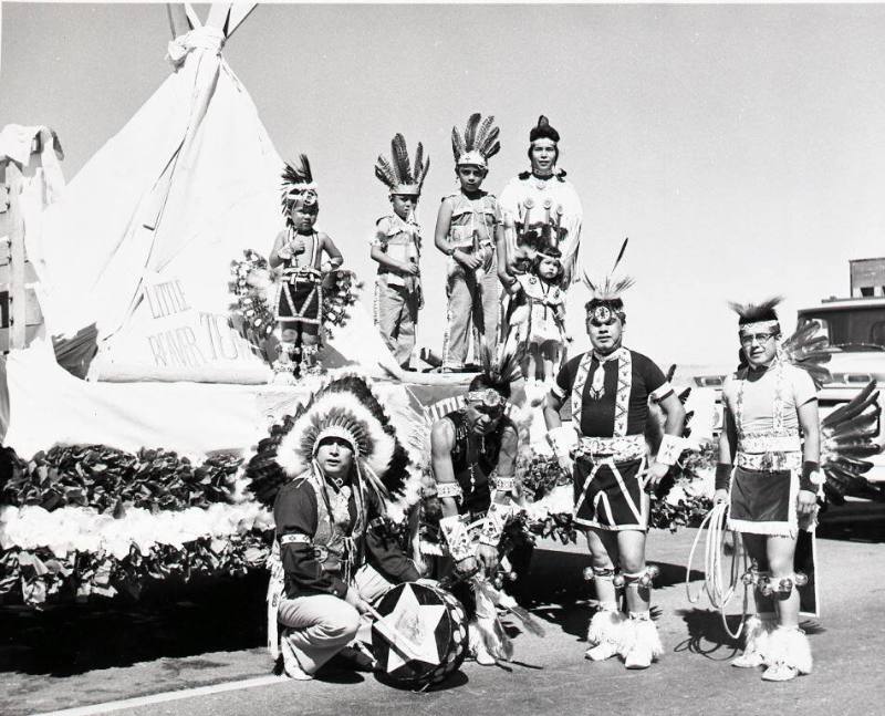 Nine Native Americans with a Little Beaver Town parade float
