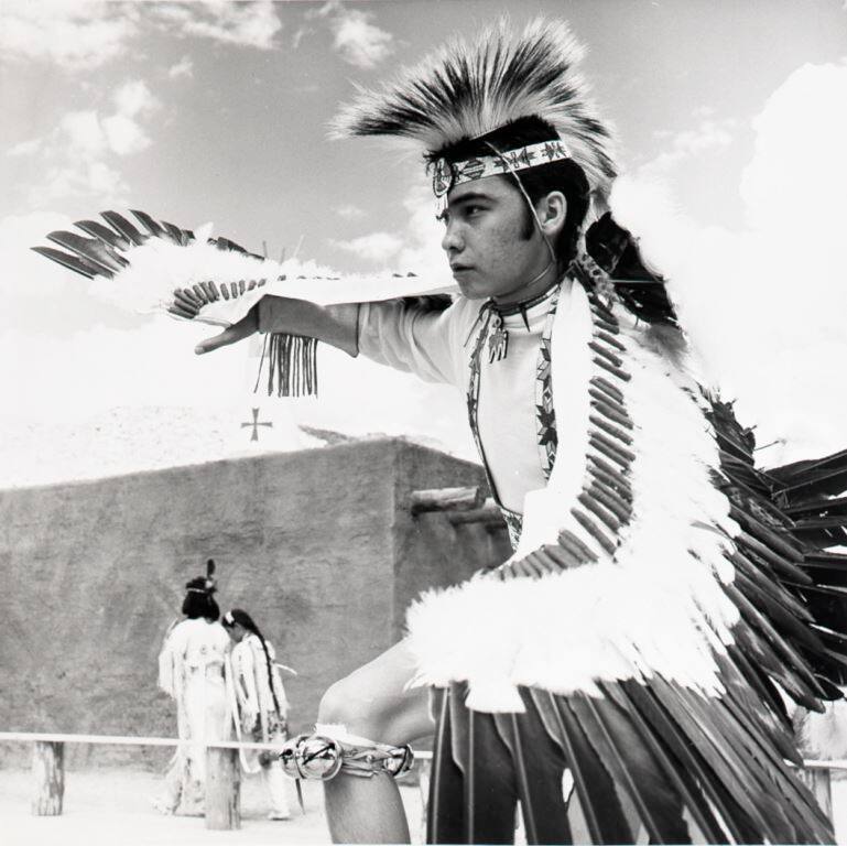 A performer dances an Apache Eagle dance at Little Beaver Town