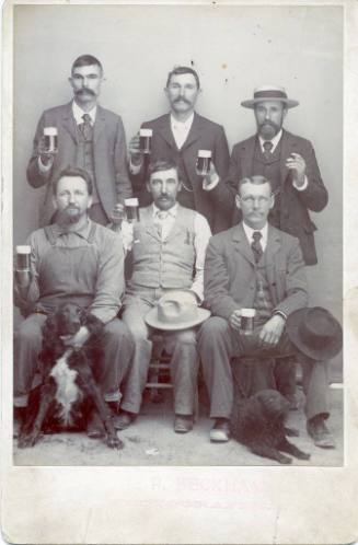 Men Holding Mugs of Beer