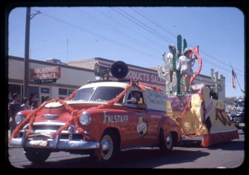 Falstaff van pulls a float in the New Mexico State Fair Parade