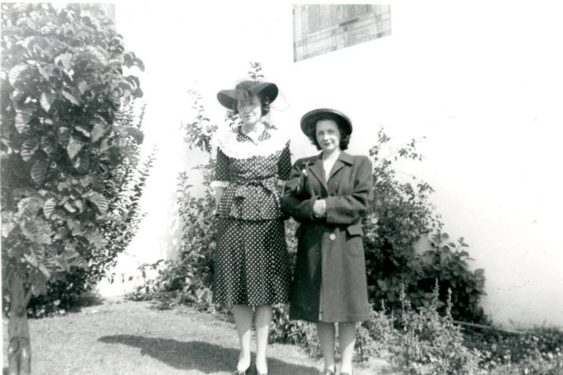 Louise Marron Cox and her daughter stand outside of a church