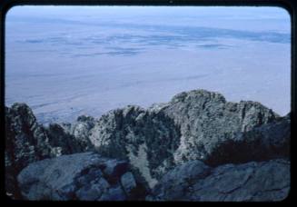 A view of Albuquerque below the crest of the Sandia Mountains