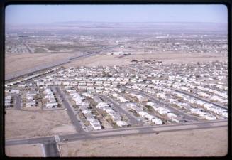 Aerial view of Interstate 40 and a housing subdivision