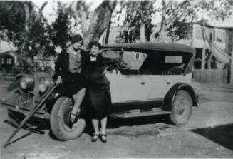 Grace Miller-Redd and Minnie May Miller pose with a car