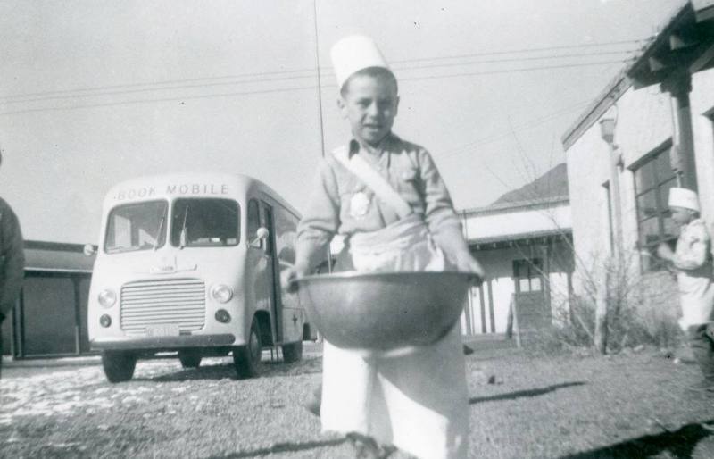 Albert Simbolla holds a large bowl of dough