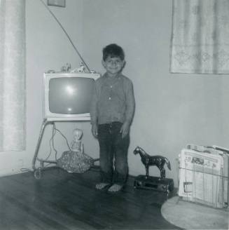 Young boy with television set