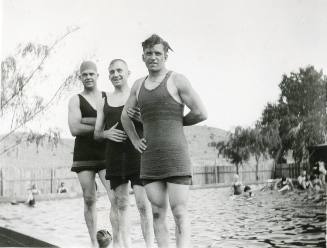 Three men at a pool
