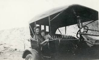 Man and woman in a Ford Model T