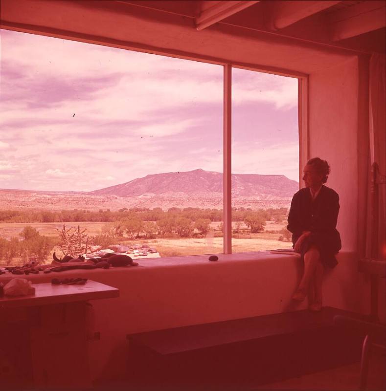 Georgia O'Keeffe seated by window