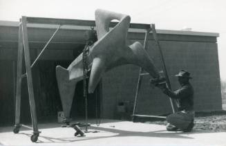 Herb Goldman with a sculpture