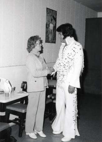 Woman Greeting an Elvis Presley Impersonator