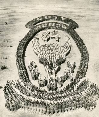 Soldiers form the insignia of the 34th Division