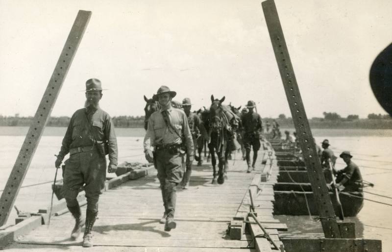 Colonel Tommy Tompkins returning across pontoon bridge.