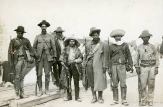Seven Mexican volunteer soldiers at attention
