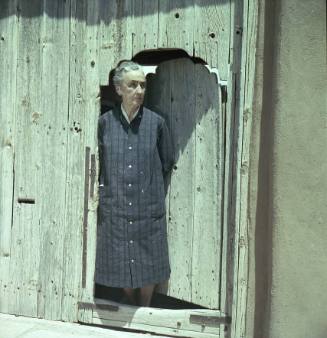 Georgia O'Keeffe standing in doorway