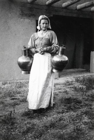 Woman Holding Water Jugs