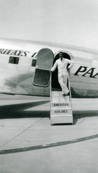 Man on the Stairway of a DC-3 Plane