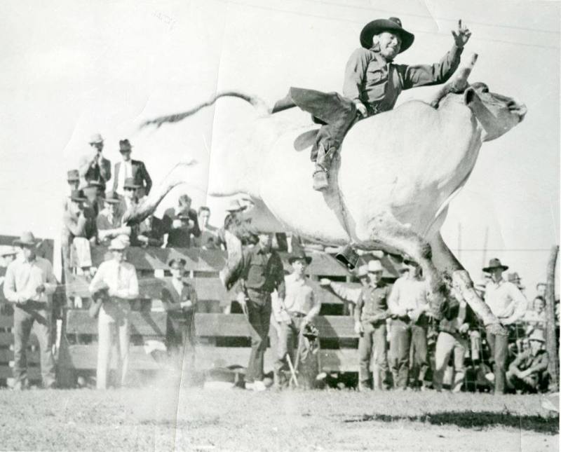 Sylvester Roane rides a bull at the Flint Hill Rodeo in Strong City, Kansas