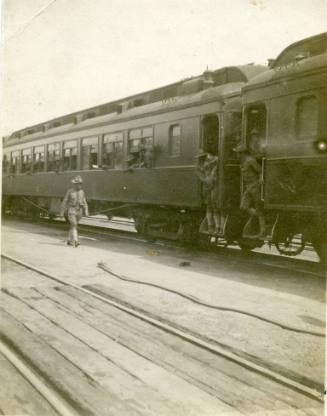 Soldiers with the Ninth Cavalry wait on a passenger train