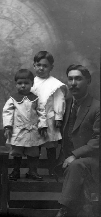 Portrait of a man and two children