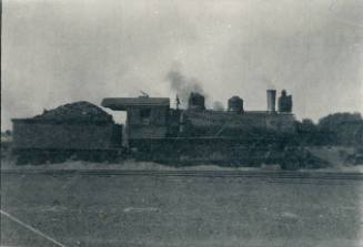Locomotive and a coal car