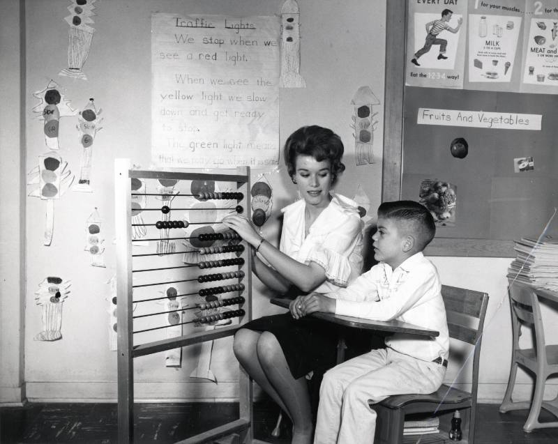 Teacher and Student with an Abacus